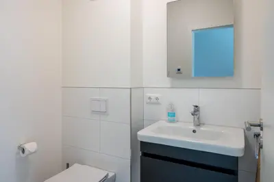 Ein Badezimmer in der Unterkunft Dünenquartier Apartment 03