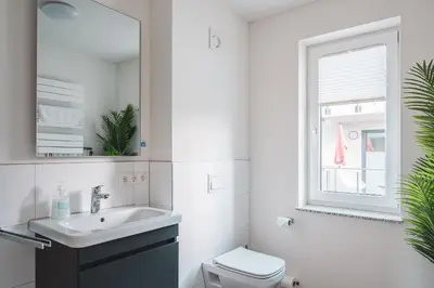 Ein Badezimmer in der Unterkunft Dünenquartier Apartment 03