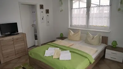Ein Bett oder Betten in einem Zimmer der Unterkunft Windflüchter Weststrand
