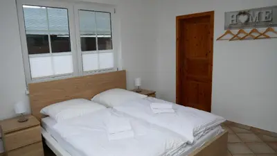 Ein Bett oder Betten in einem Zimmer der Unterkunft Windflüchter Nordstrand