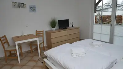 Ein Bett oder Betten in einem Zimmer der Unterkunft Windflüchter Nordstrand