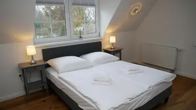 Ein Bett oder Betten in einem Zimmer der Unterkunft Windflüchter Treibholz