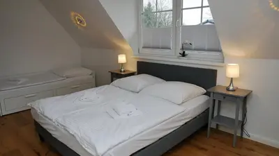 Ein Bett oder Betten in einem Zimmer der Unterkunft Windflüchter Treibholz