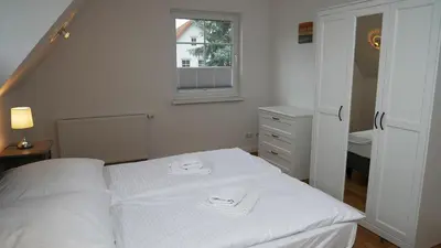 Ein Bett oder Betten in einem Zimmer der Unterkunft Windflüchter Treibholz