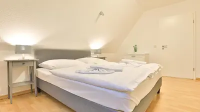 Ein Bett oder Betten in einem Zimmer der Unterkunft Windflüchter Brise