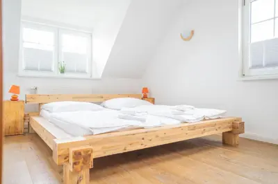 Ein Bett oder Betten in einem Zimmer der Unterkunft Windflüchter Hus