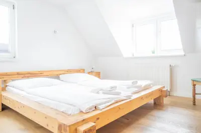 Ein Bett oder Betten in einem Zimmer der Unterkunft Windflüchter Hus