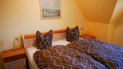 Ein Bett oder Betten in einem Zimmer der Unterkunft Haus 
