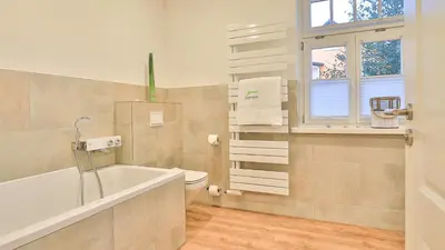 Ein Badezimmer in der Unterkunft Mühlenhaus Tretmühle