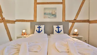 Ein Bett oder Betten in einem Zimmer der Unterkunft Mühlenhaus Wassermühle