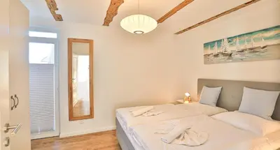 Ein Bett oder Betten in einem Zimmer der Unterkunft Mühlenhaus Wassermühle