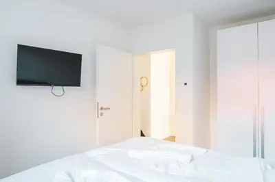 Ein Bett oder Betten in einem Zimmer der Unterkunft Dünenquartier Apartment 07