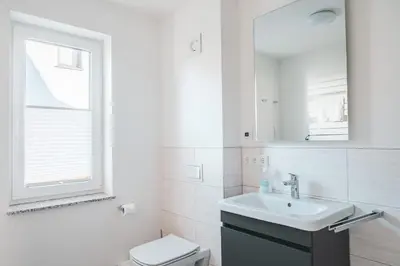 Ein Badezimmer in der Unterkunft Dünenquartier Apartment 07