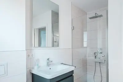 Ein Badezimmer in der Unterkunft Dünenquartier Apartment 07