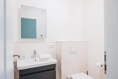 Ein Badezimmer in der Unterkunft Dünenquartier Apartment 07