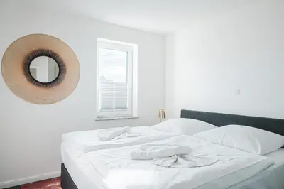 Ein Bett oder Betten in einem Zimmer der Unterkunft Dünenquartier Apartment 08