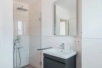 Ein Badezimmer in der Unterkunft Dünenquartier Apartment 08