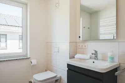Ein Badezimmer in der Unterkunft Dünenquartier Apartment 09