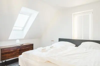 Ein Bett oder Betten in einem Zimmer der Unterkunft Dünenquartier Apartment 10
