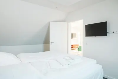 Ein Bett oder Betten in einem Zimmer der Unterkunft Dünenquartier Apartment 10
