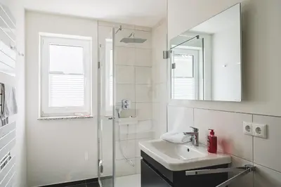 Ein Badezimmer in der Unterkunft Dünenquartier Apartment 11