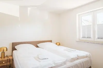 Ein Bett oder Betten in einem Zimmer der Unterkunft Dünenquartier Apartment 11