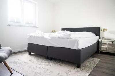 Ein Bett oder Betten in einem Zimmer der Unterkunft Dünenquartier Apartment 12