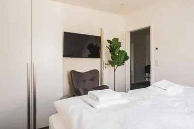 Ein Bett oder Betten in einem Zimmer der Unterkunft Dünenquartier Apartment 13