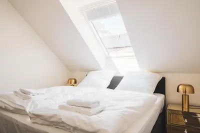 Ein Bett oder Betten in einem Zimmer der Unterkunft Dünenquartier Apartment 13
