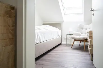 Ein Bett oder Betten in einem Zimmer der Unterkunft Dünenquartier Apartment 14