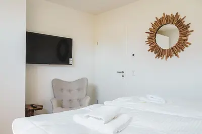 Ein Bett oder Betten in einem Zimmer der Unterkunft Dünenquartier Apartment 15