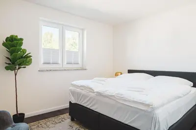 Ein Bett oder Betten in einem Zimmer der Unterkunft Dünenquartier Apartment 16
