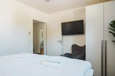 Ein Bett oder Betten in einem Zimmer der Unterkunft Dünenquartier Apartment 16