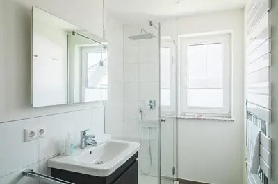 Ein Badezimmer in der Unterkunft Dünenquartier Apartment 17