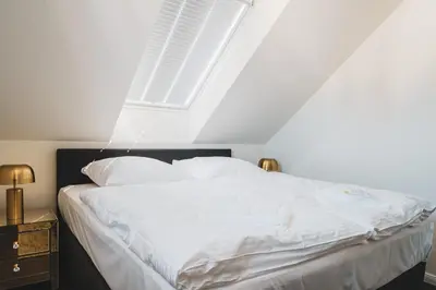 Ein Bett oder Betten in einem Zimmer der Unterkunft Dünenquartier Apartment 17