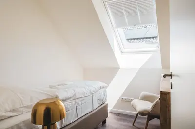 Ein Bett oder Betten in einem Zimmer der Unterkunft Dünenquartier Apartment 18
