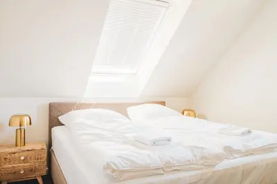 Ein Bett oder Betten in einem Zimmer der Unterkunft Dünenquartier Apartment 22