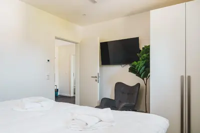 Ein Bett oder Betten in einem Zimmer der Unterkunft Dünenquartier Apartment 25