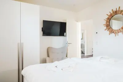 Ein Bett oder Betten in einem Zimmer der Unterkunft Dünenquartier Apartment 26