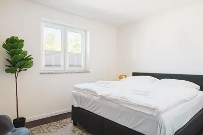Ein Bett oder Betten in einem Zimmer der Unterkunft Dünenquartier Apartment 27