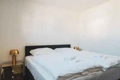 Ein Bett oder Betten in einem Zimmer der Unterkunft Dünenquartier Apartment 27