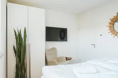 Ein Bett oder Betten in einem Zimmer der Unterkunft Dünenquartier Apartment 28