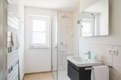 Ein Badezimmer in der Unterkunft Dünenquartier Apartment 28