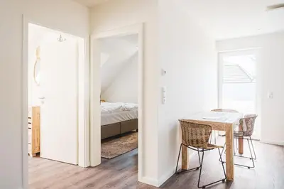 Ein Bett oder Betten in einem Zimmer der Unterkunft Dünenquartier Apartment 28