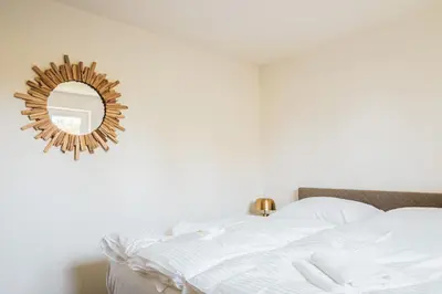 Ein Bett oder Betten in einem Zimmer der Unterkunft Dünenquartier Apartment 28