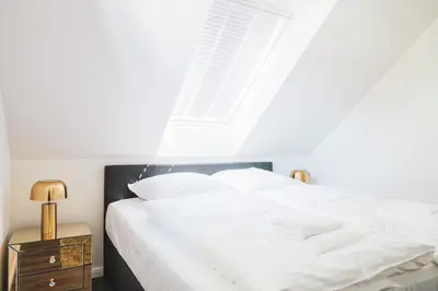 Ein Bett oder Betten in einem Zimmer der Unterkunft Dünenquartier Apartment 29