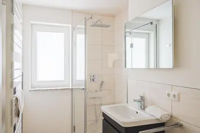 Ein Badezimmer in der Unterkunft Dünenquartier Apartment 30