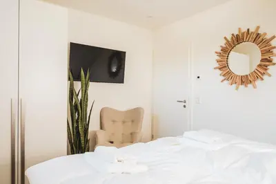 Ein Bett oder Betten in einem Zimmer der Unterkunft Dünenquartier Apartment 30