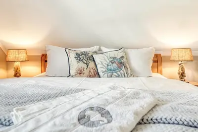 Ein Bett oder Betten in einem Zimmer der Unterkunft FEWO MW8 Zingst - 5min zum Strand - Ostseefeeling & hochwertige Küchenausstattung