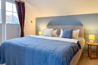 Ein Bett oder Betten in einem Zimmer der Unterkunft Seeluft 4